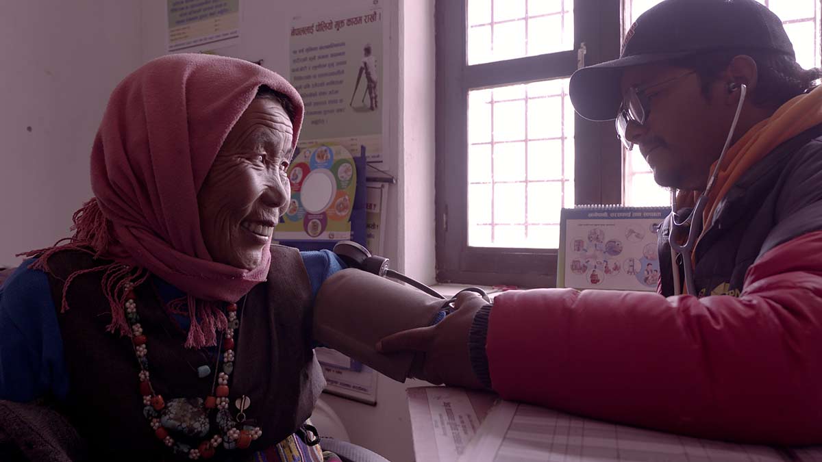Suresh is learning Sanskrit to bridge the language gap between him and his patients like Aangmo Gurung (left), who speak a Tibetan dialect and do not understand Nepali.