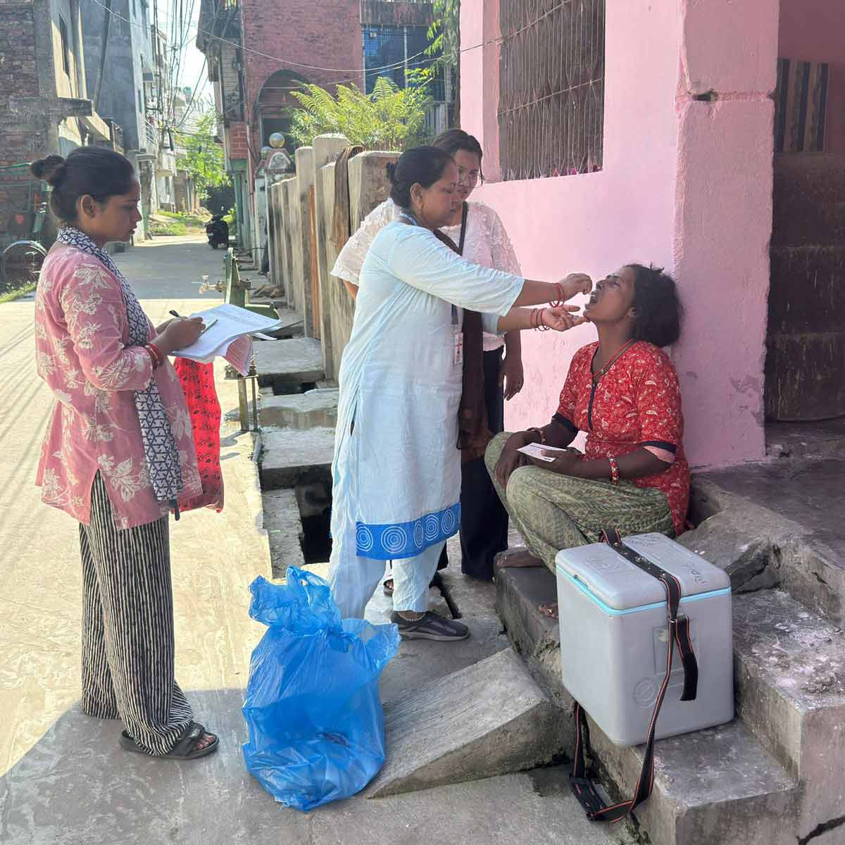 Health workers reach households to vaccinate those who missed the doses. Credit: Bandana Tharu Chaudhary
