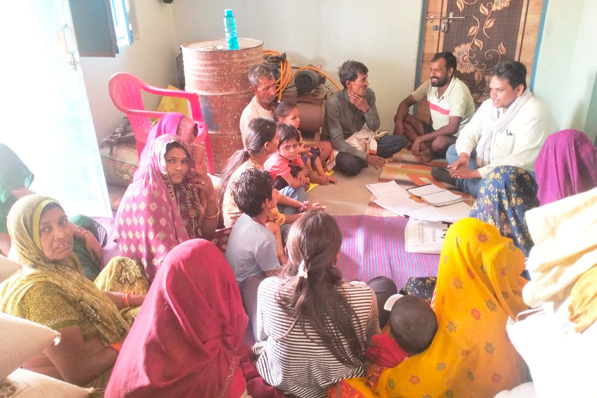 Health workers engaging with community members