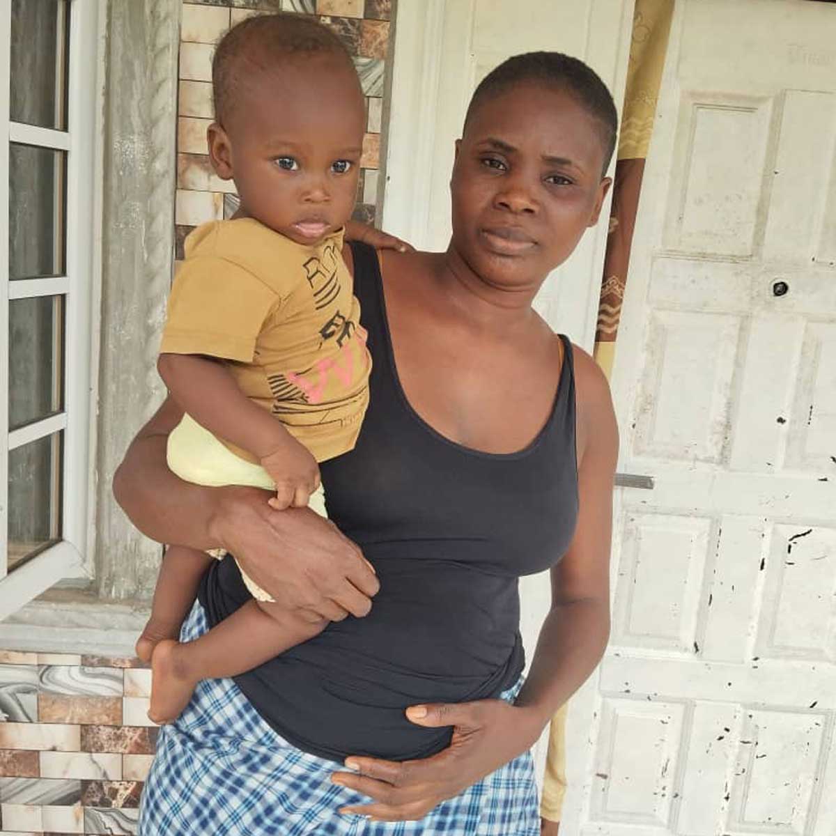 Ms. Hope PraiseGod and seven-month-old Samara Akuma. Credit: Lara Samuel