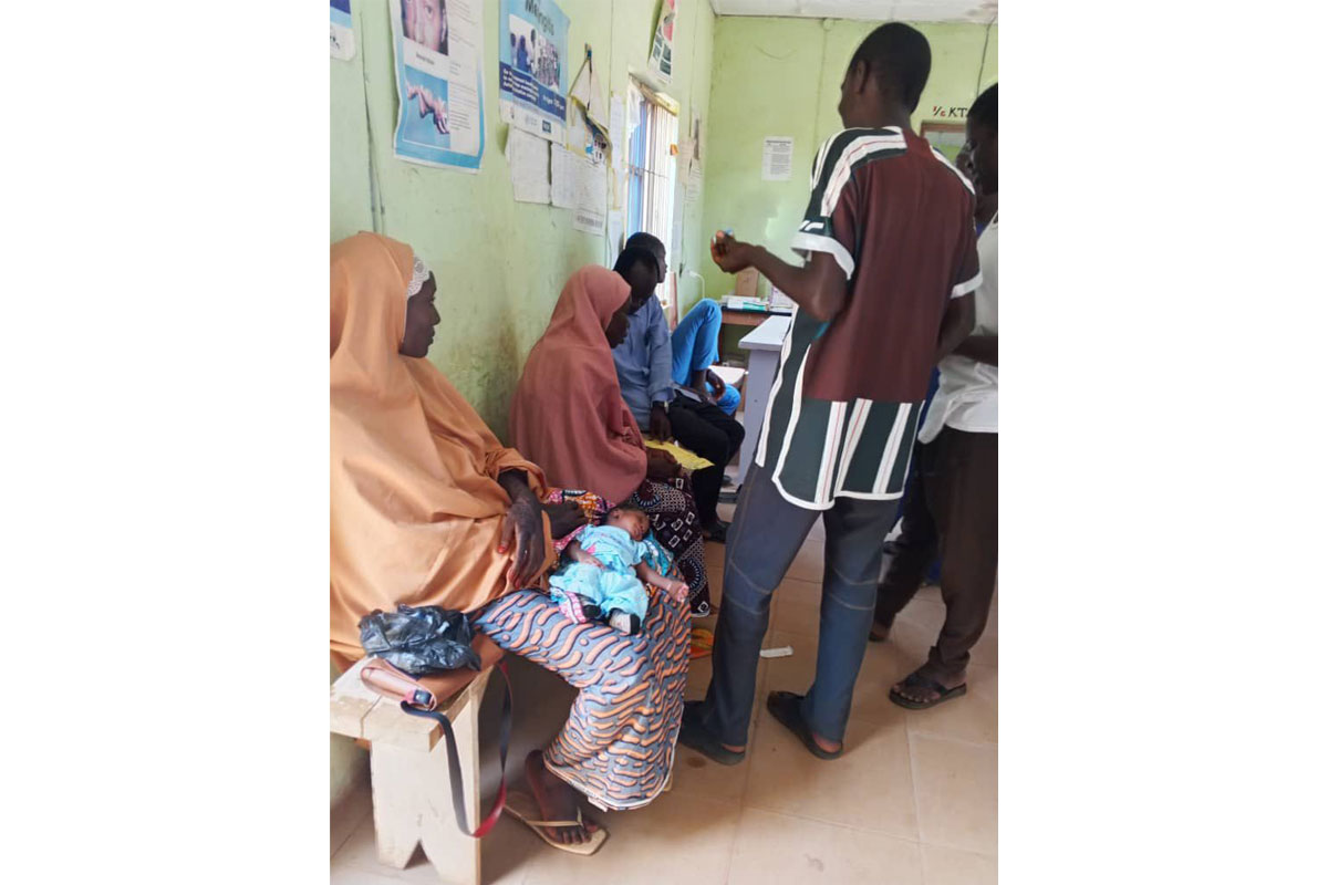 An immunisation officer attends to mothers at the Primary Health Centre, Ingawa. Credit: Jesusegun Alagbe