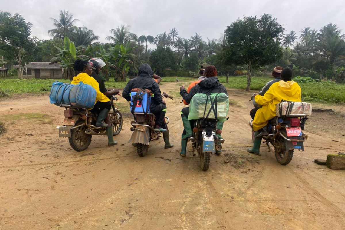Bike riders helping to bidge communication gaps by easing transportation and creating access in to the hinterlands. Credit: Fri Delphine