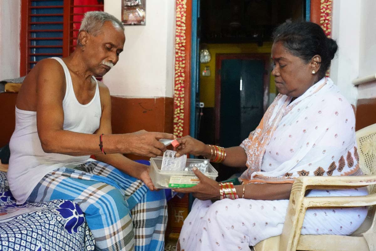 Rama Rao from Chinavanka village, Palasa district, Andhra Pradesh, receives his CKDu medication from his wife. Credit: K Gupta