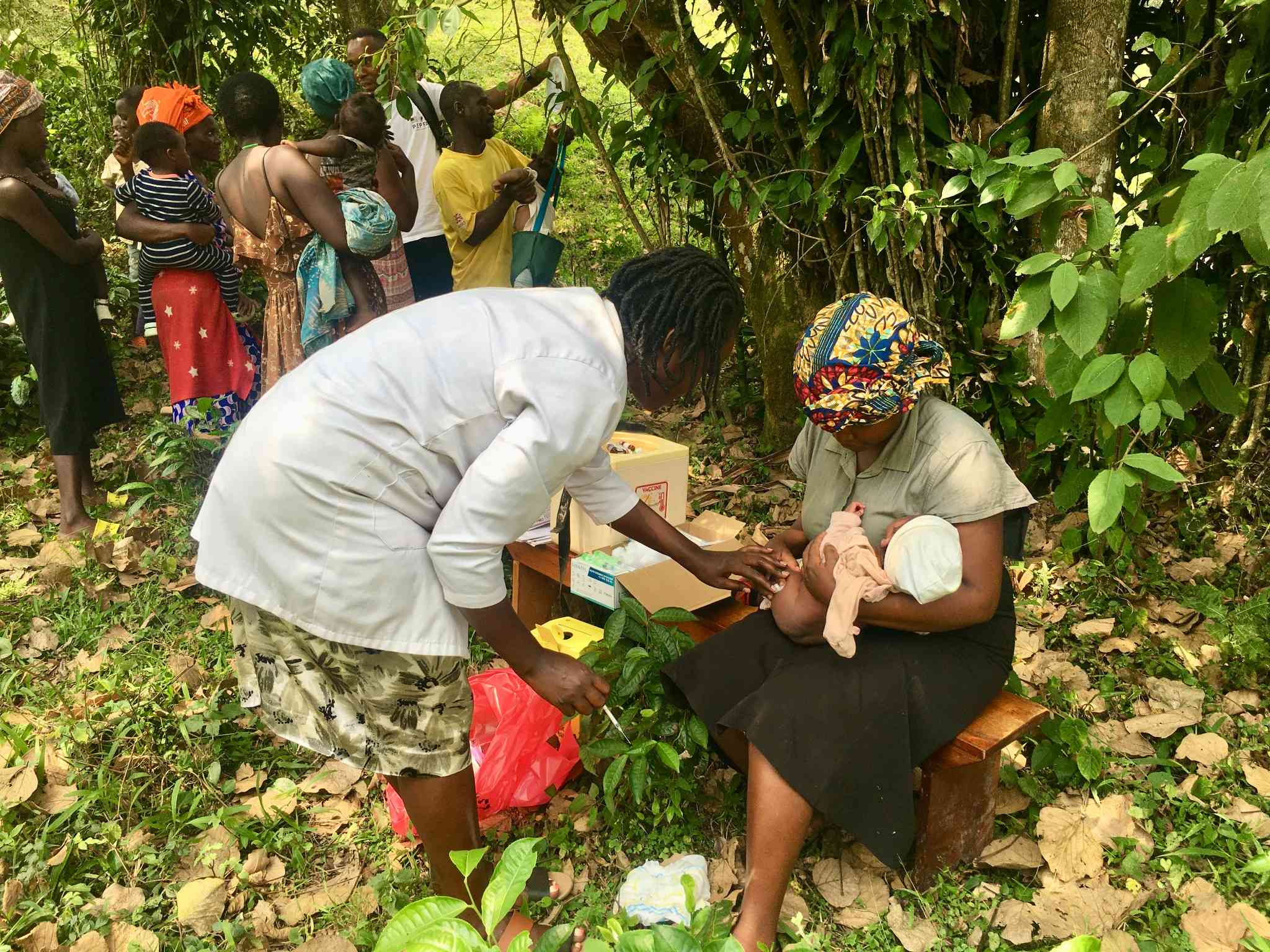 Sylvia Nyasuku after injecting a baby. She says vaccines have helped to control measles, diarrhoea and other VPDs in hard-to-reach tea communities in Uganda. Credit_John Agaba
