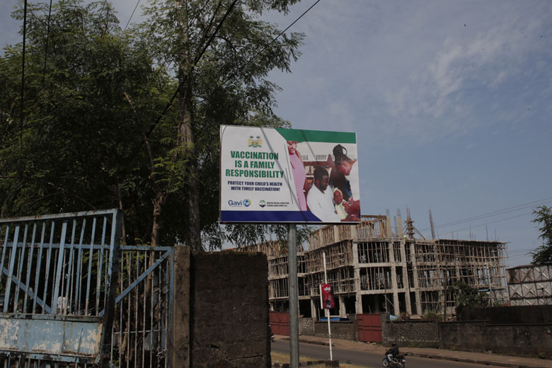 A vaccination billboard in Freetown. Credit: Saidu Bah