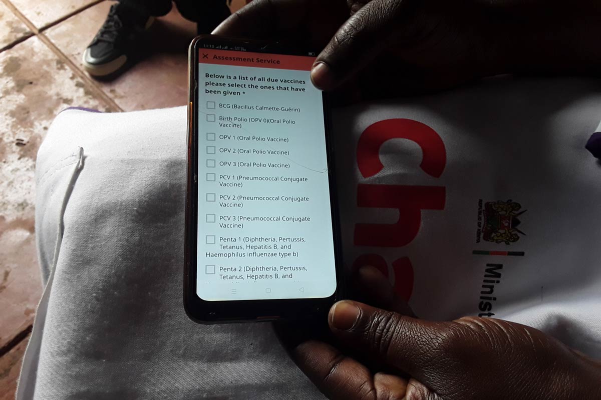 In the community, vaccine follow-up is conducted by Community Health Promoters using eCHIS (Electronic Community Health Information System), launched in 2023. Credit: Joyce Chimbi