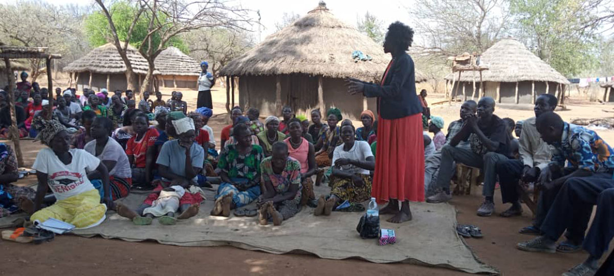 A VHT member addressing the community in Agoro, Lamwo, urging them to report suspected cholera cases to their nearest health facilities. Credit: Denis Ocula
