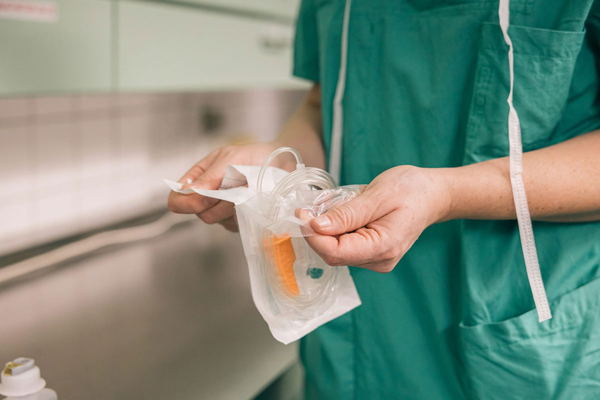 Doctor handles sterile equipment. Credit: Amparo Garcia, Shutterstock