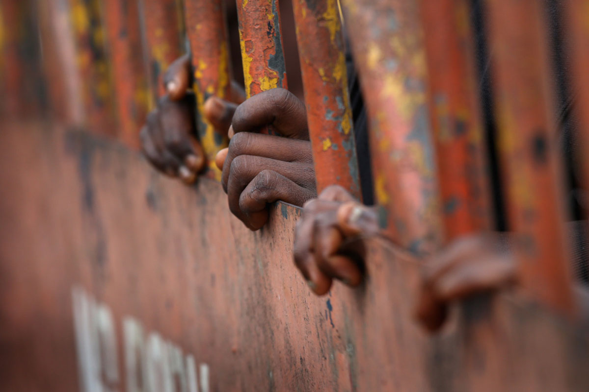 In the 2014 Ebola epidemic in Liberia, residents of the West Point slum were quarantined by the government behind closed gates. Visual: John Moore/Getty Images