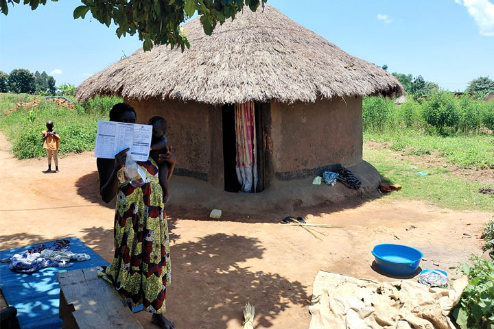 Monica Dawaru from Ocevu village in Tilevu parish Arua disrict showing her vaccination card. Credit: John Musenze