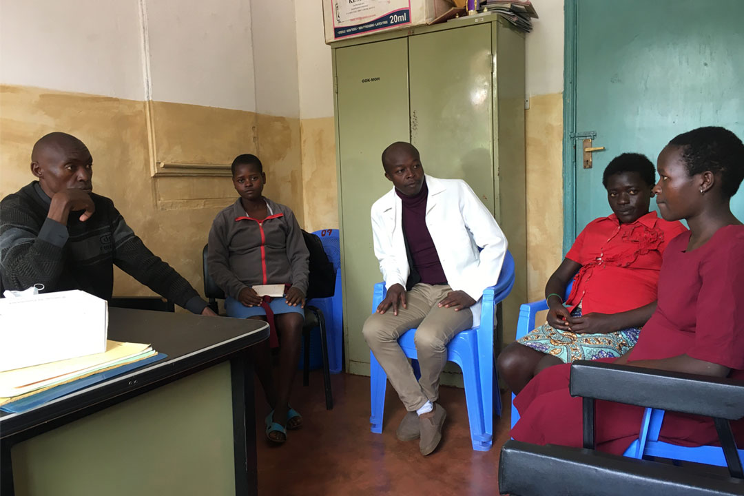 Nurses Joab Luta and Hesborn Samba speaking to pregnant teenage girls at Kopsiro health centre in Mt. Elgon. Credit: Pius Sawa