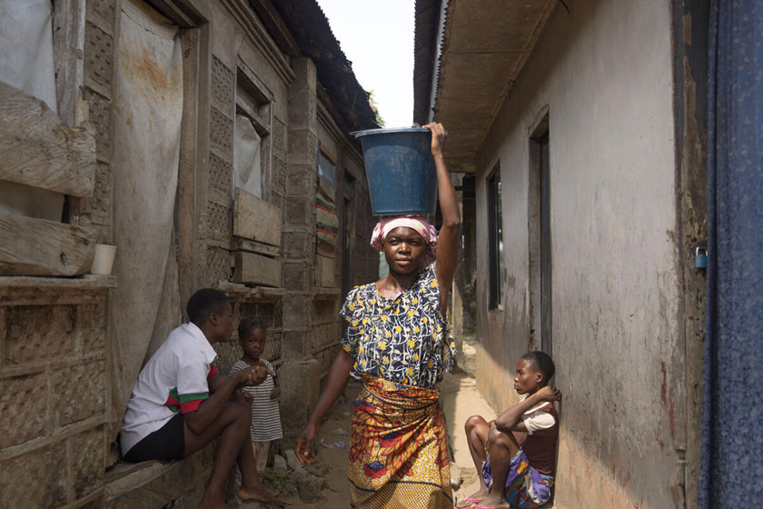 Permanent, 23, fetches water from the river behind her house in the Onuegbu community in Bayelsa State, where she sells grilled fish. Ogbia, Nigeria. December 17, 2024. Credit: Jérôme Sessini/ Magnum Photos