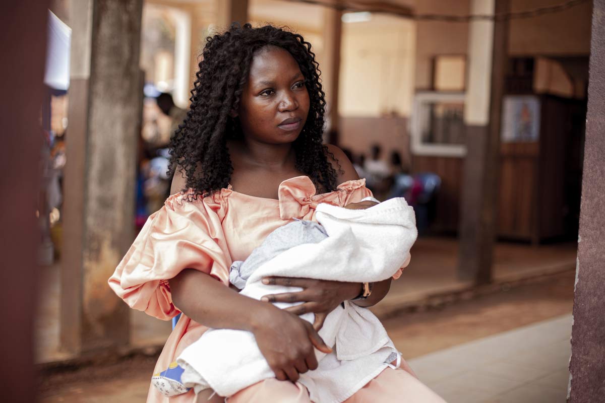 Helen Akono with one of her twins during the malaria vaccine introduction in Cameroon, a year ago. Credit: Gavi/2024/Go'tham Industry
