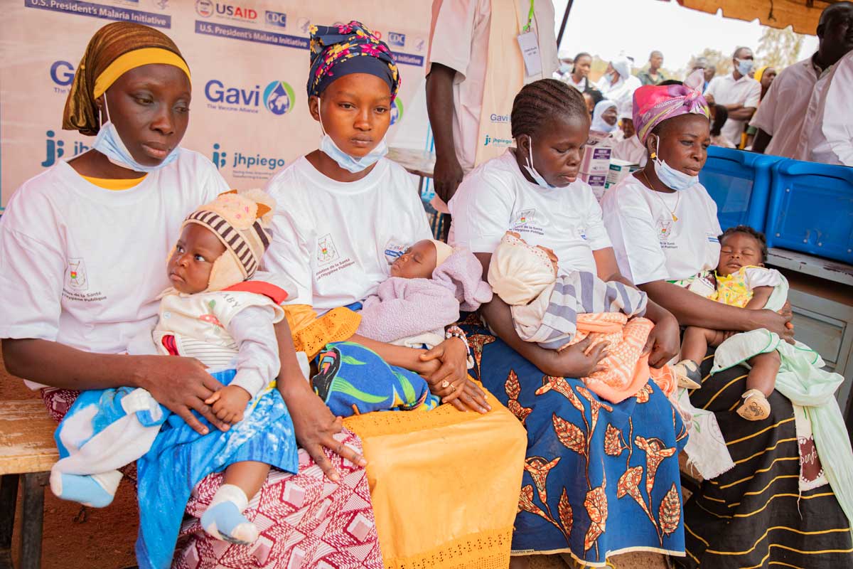 Mothers and their children attend a malaria vaccination session in Burkina Faso. Credit: Gavi/2024/Arnauld Yalgwueogo
