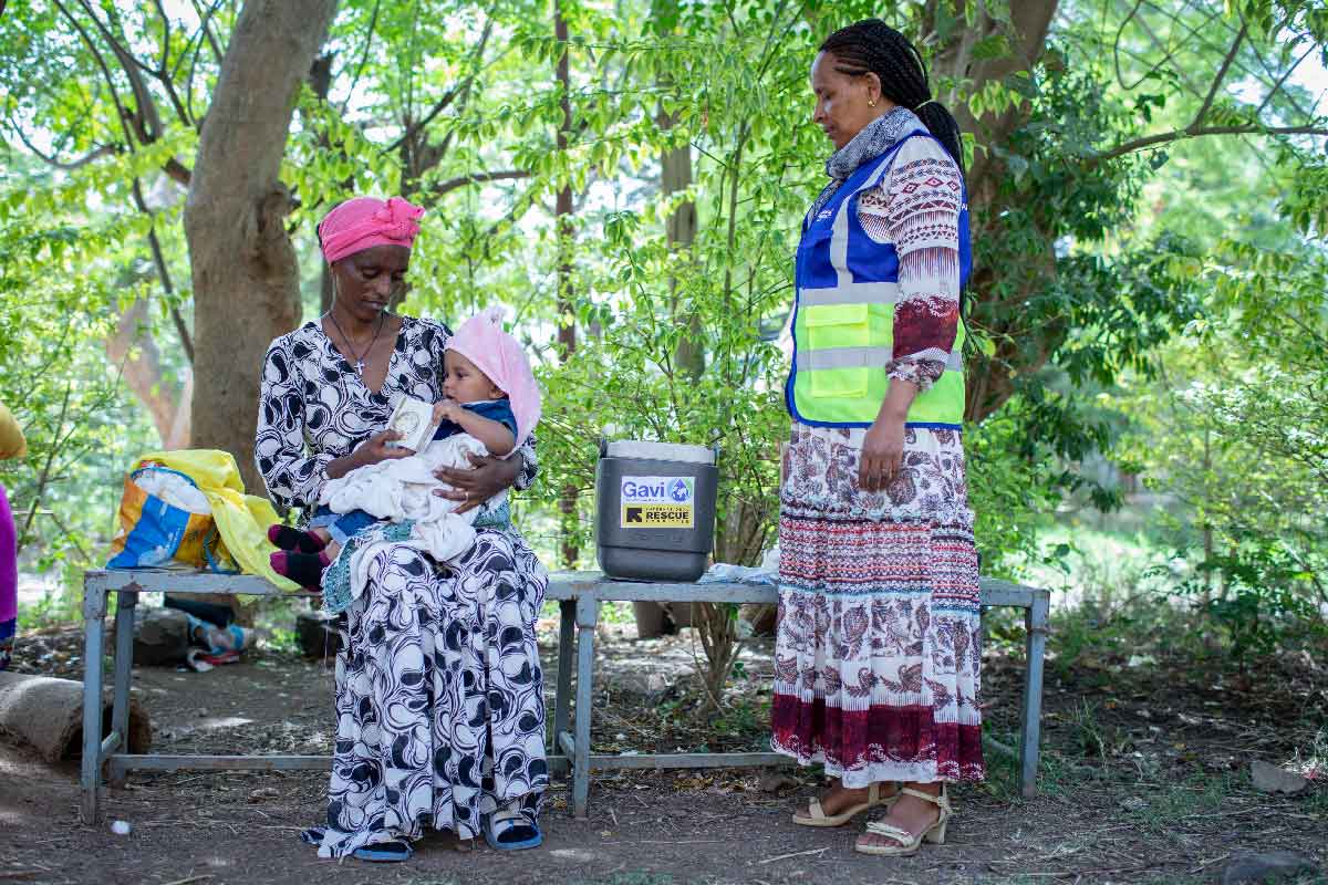 A mother awaits for her child to receive the measles vaccine from a health worker during a routine vaccination session in Ethiopia. Credit: Gavi/2024/Mulugeta Ayene