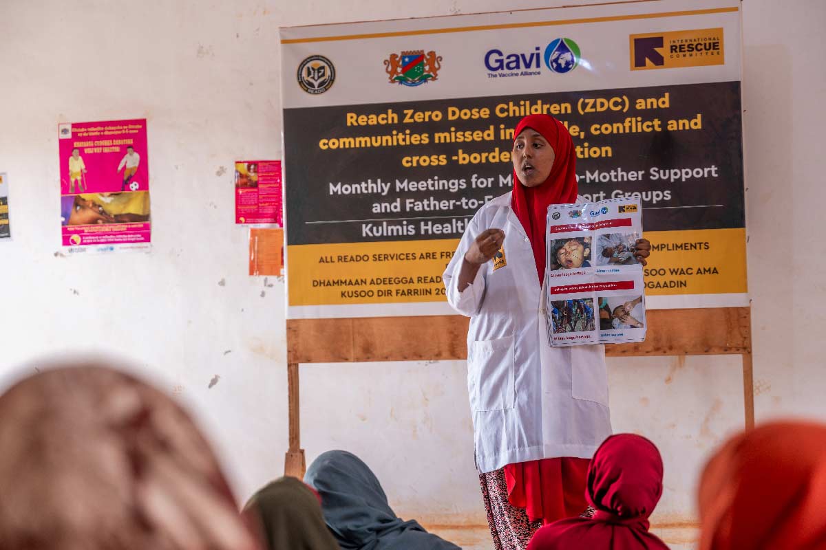 A community mobiliser addresses a group of mothers, raising awareness about the importance of vaccinations for the health and future of their children. This is part of the Reach Zero Dose Children (ZDC) campaign in Somalia, aimed at identifying children who have not received any vaccines, or missed communities by healthcare systems. Credit: Gavi/2024/Mohamed Abdihakim Ali