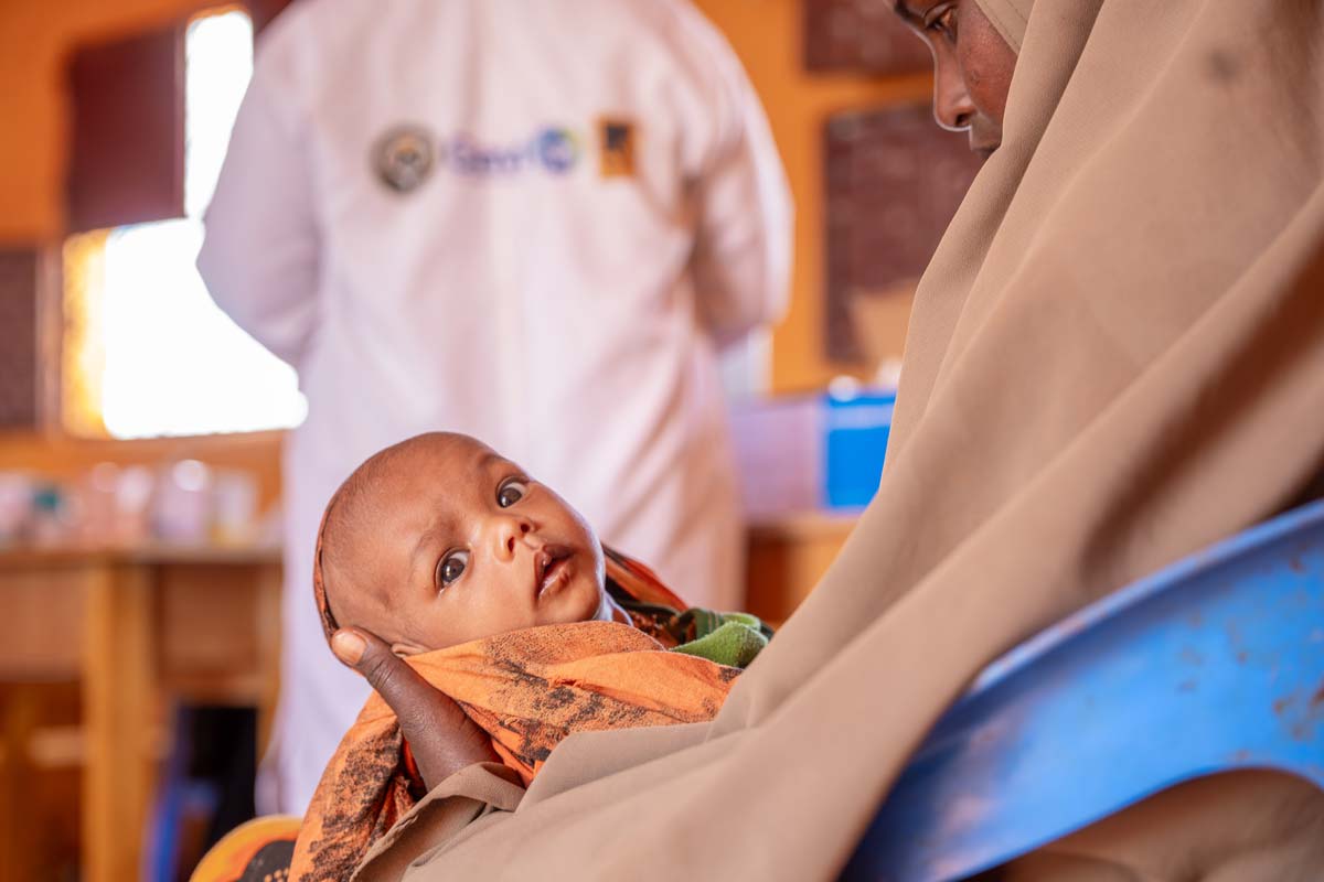 A child held by its mother after receiving the necessary doses of vaccines as part of the Reach Zero Dose Children (ZDC) campaign in Somalia. Credit: Gavi/2024/Mohamed Abdihakim Ali