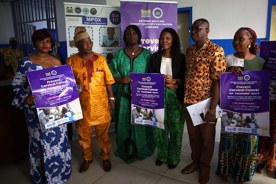Sierra Leone health workers hold HPV vaccine posters in Freetown ahead of the vaccination of in-school and out-of-school girls between the ages of 11 and 18. Credit: Saidu Bah