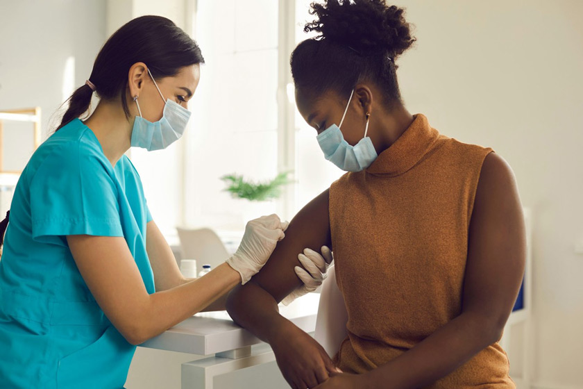 Woman receives vaccination. Credit: Studio Romantic/Shutterstock