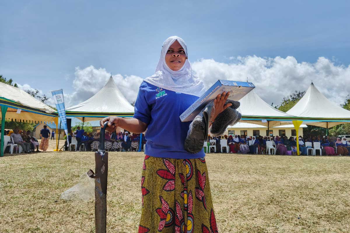 Chiku Abdallah, a Community Health Worker (CHW) holds her working tools shortly after her graduation under the Integrated Community Health Workers Program in Lindi Region. Credit: Ministry of Health Tanzania