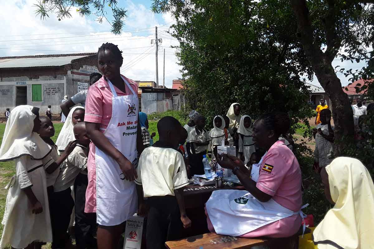 Children at Al-Khamis Islamic Day primary and nursery school queue for vaccination against yellow fever. Credit: Joyce Chimbi