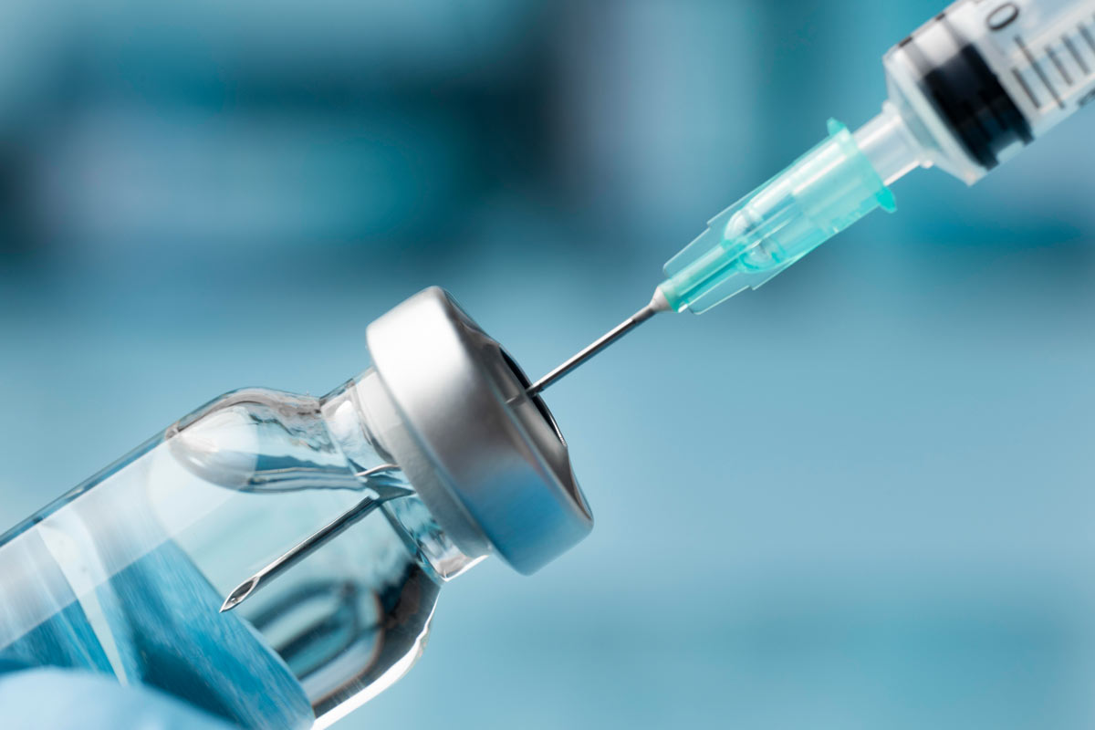 COVID vaccine and vial. Credit: Freepik