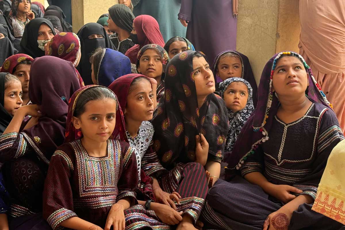 More than a hundred women and girls gathered in Rehri Goth for an HPV vaccination awareness session, hosted by the Health Education Literacy Program (HELP), a civil society organiszation working to increase vaccine uptake in under-served areas. Credit: Huma Khawar
