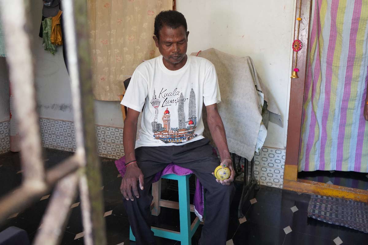 Madanala Giridhar Rao exercises with a stress ball as advised by doctors to improve blood flow to his arm and keep the vein used for dialysis strong. Credit: Kanika Gupta