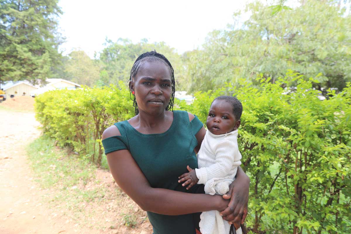 Ms Mercy Akoth at the Rangwe Subcounty Hospital with her six month old baby ahead of vaccine administration. Credit: George Omondi