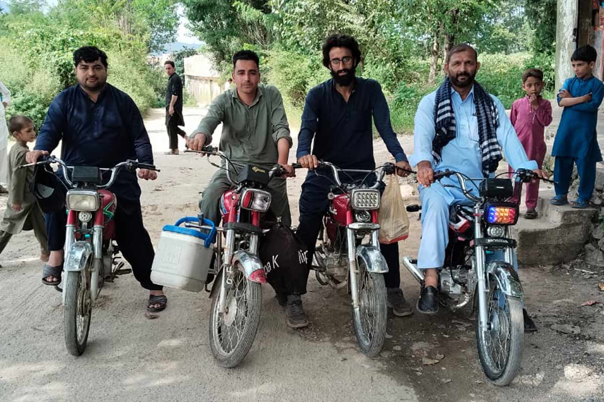 Mobile vaccination team on motorbikes reaching communities in difficult areas. Credit: EPI KP