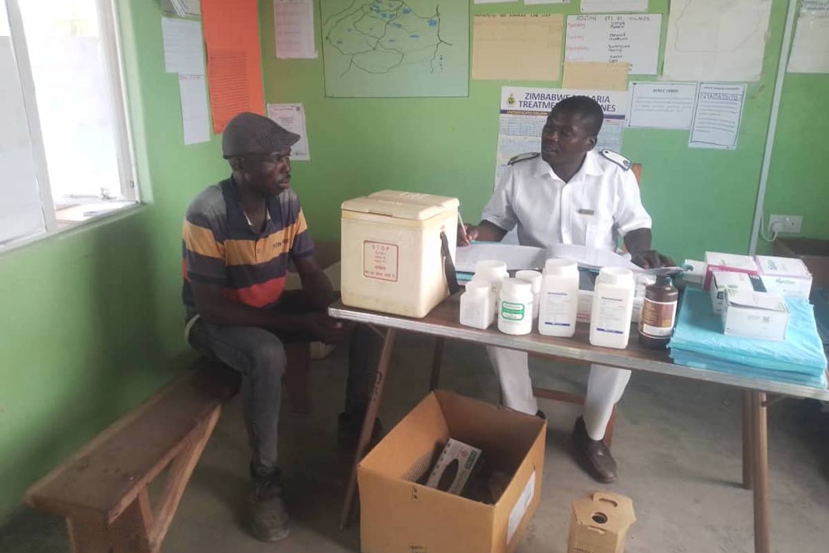 Primary care nurse Richard Vherukayi at Nyamatsito health centre attending to a patient. Credit: Enos Denhere