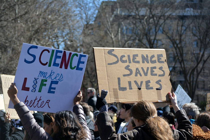 Protesters marching at a Stand up for Science rally against cuts to scientific research. Credit: Christopher Penler/ Shuttershock