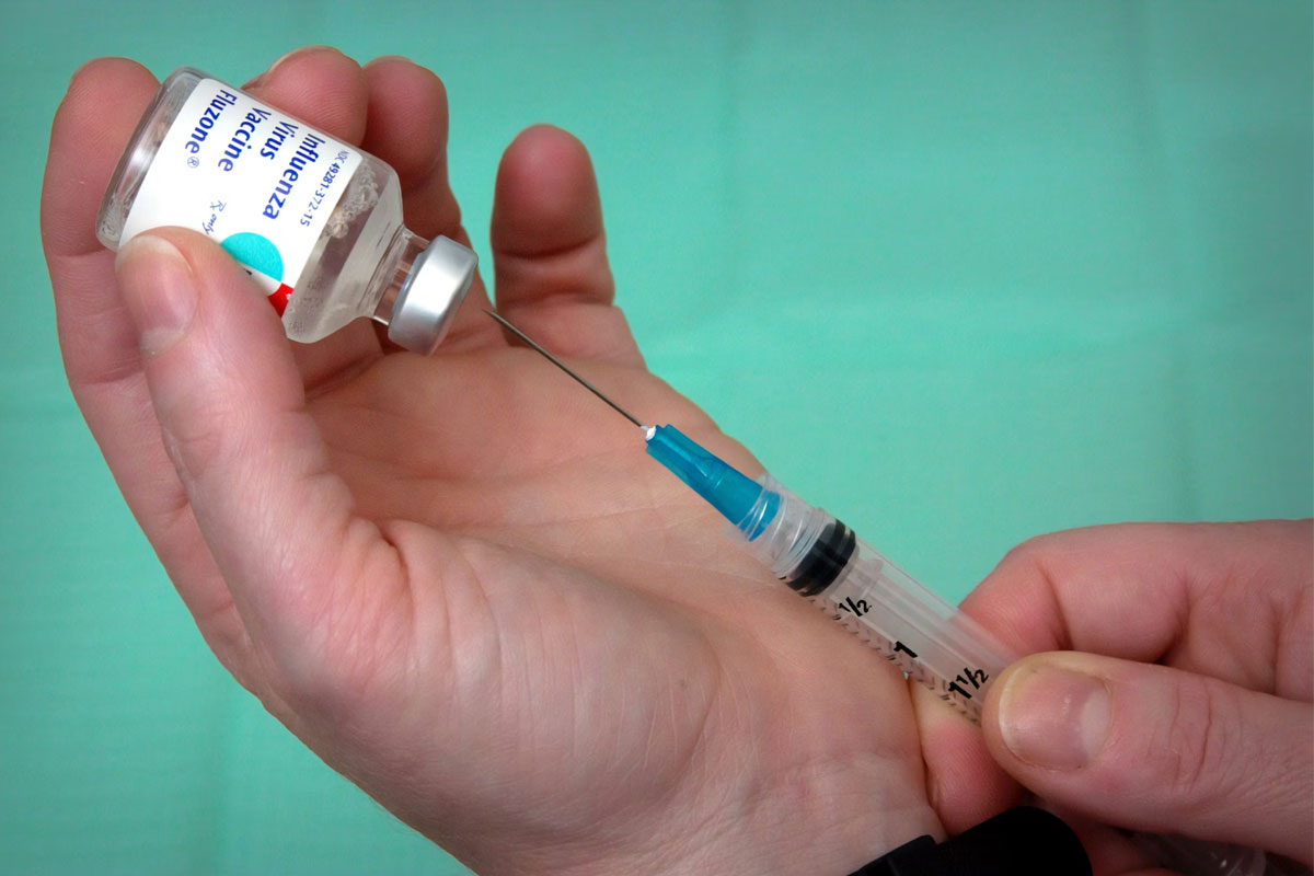 Syringe extracts vaccine dose. Credit: Centers for Disease Control and Prevention (CDC)