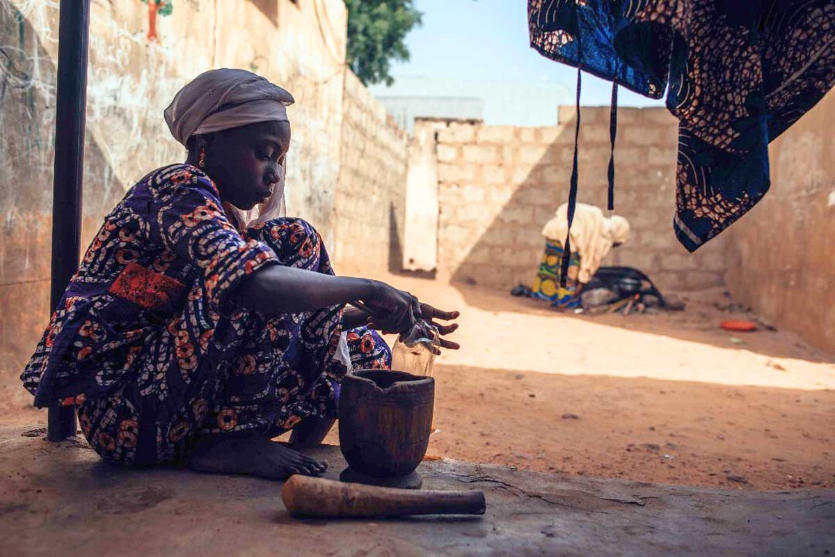 A woman in Nigeria prepares food. Image by KC Nwakalor / USAID via Flickr (CC BY 2.0).