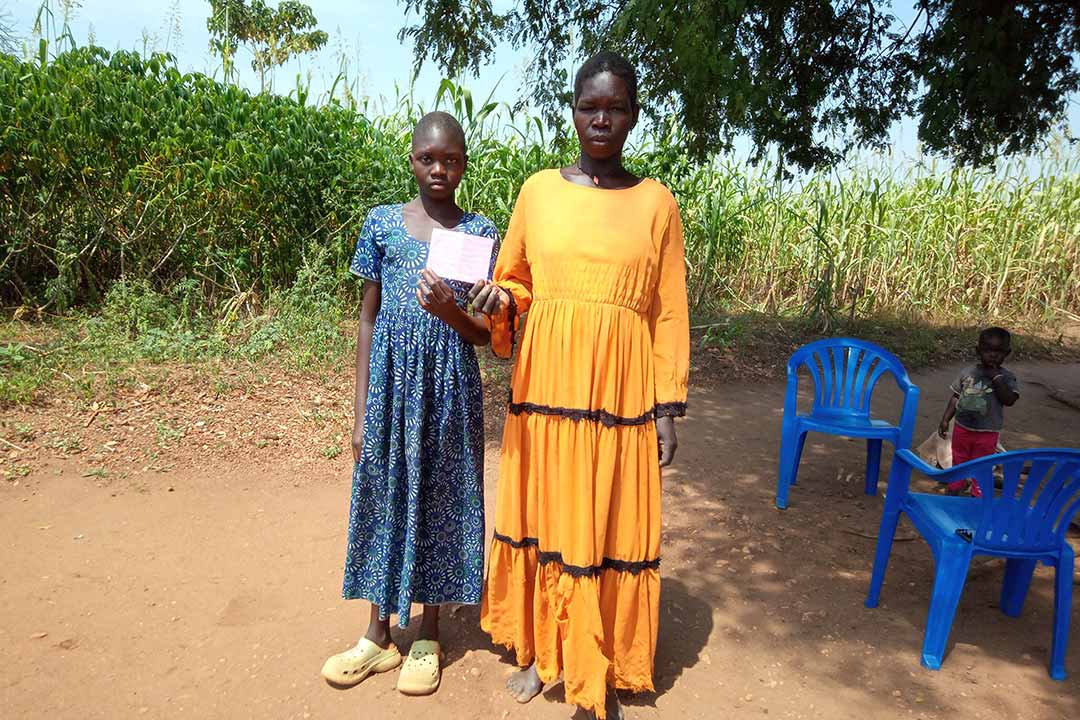 10-year-old Swail Fidaya with her mother. Credit: John Musenze