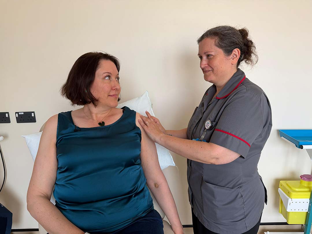 Volunteer Clare Howard is dosed with Moderna's mRNA-1018 candidate vaccine in clinical trial, April 2026.