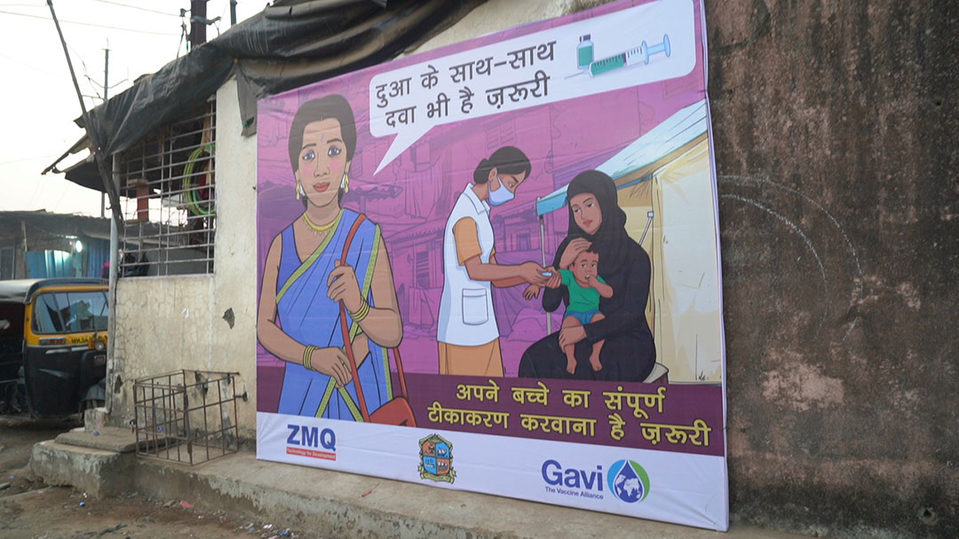A public awareness poster urges parents to ensure complete immunisation for their children. Credit: Amman Shaikh