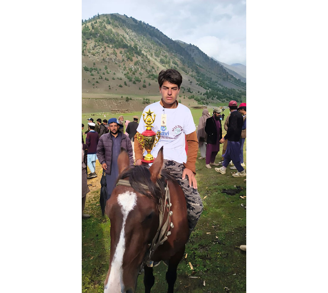 A rider celebrates after winning a horse-riding competition organized by the HUJRA Village Support Organization in the alpine pastures of Upper Kohistan district. Credit: HUJRA