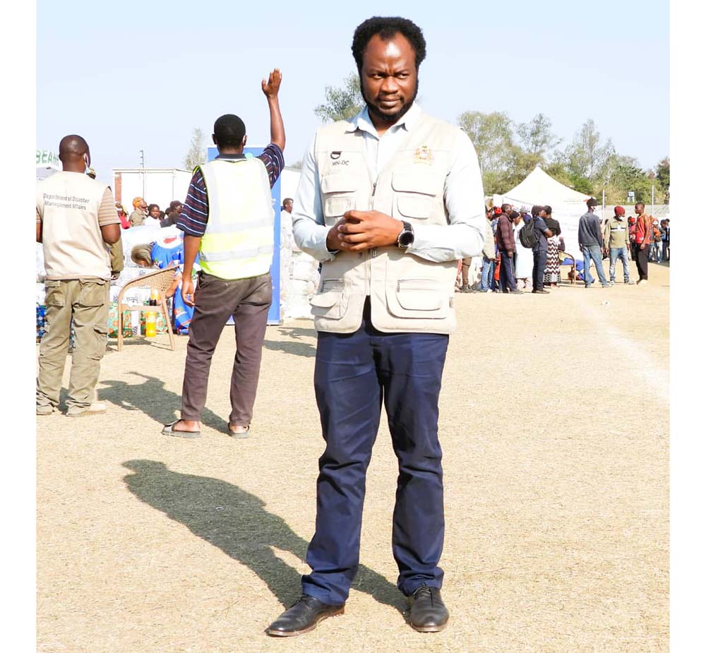 Dr Francis Makiya in line of duty at Joyce Chitsulo Stadium temporary shelter. Credit: Josephine Chinele