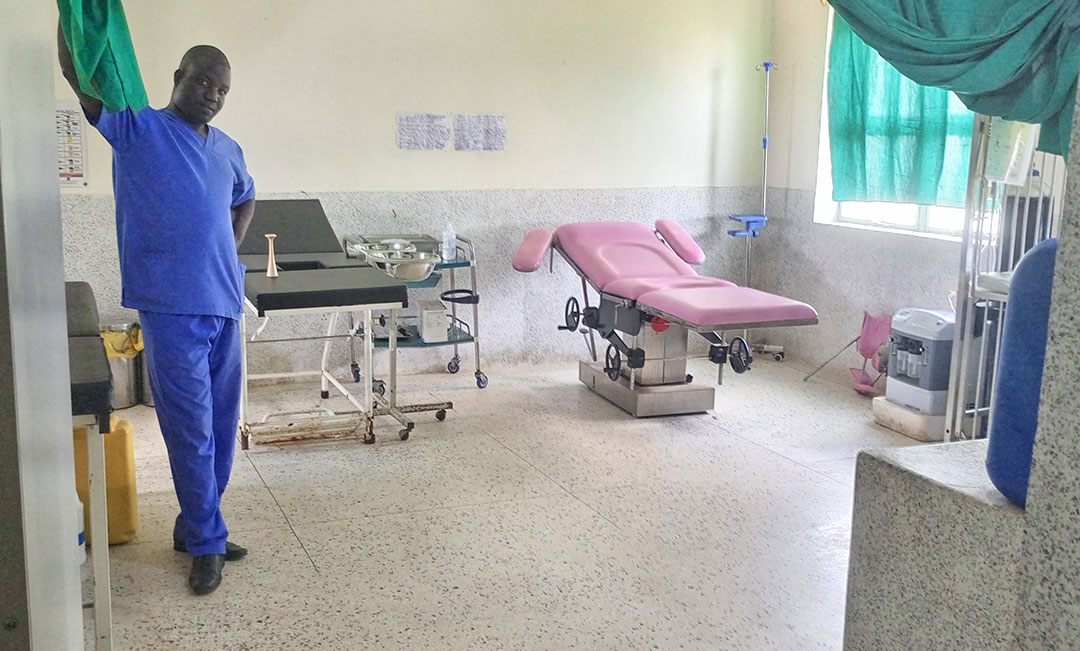 Dr Justin Ojok, senior clinical officer, in the maternity ward now powered thanks to Gavi-supported solar. Credit: John Musenze