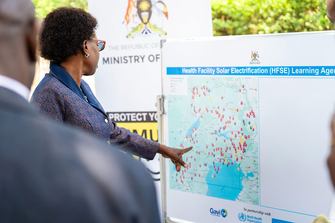 Health minsiter Jane Ruth Aceng shows where the solar power project will be implemented. Credit: John Musenze