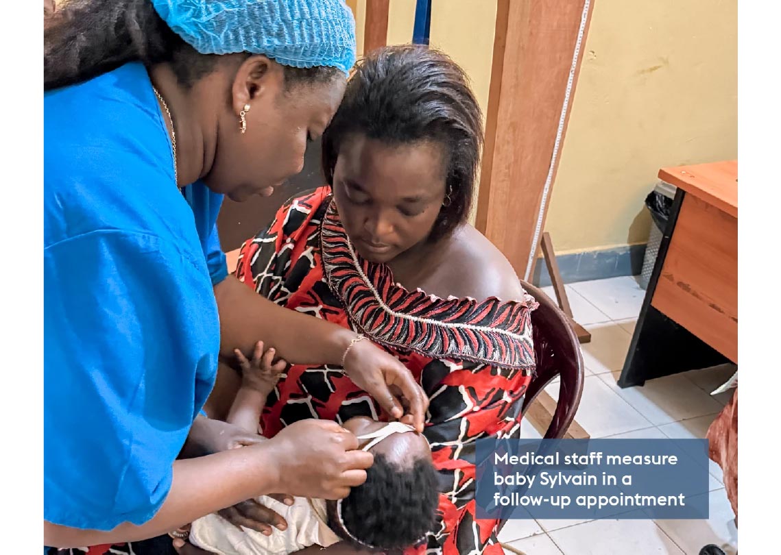 Medical staff measure baby Sylvain in a follow-up appointment