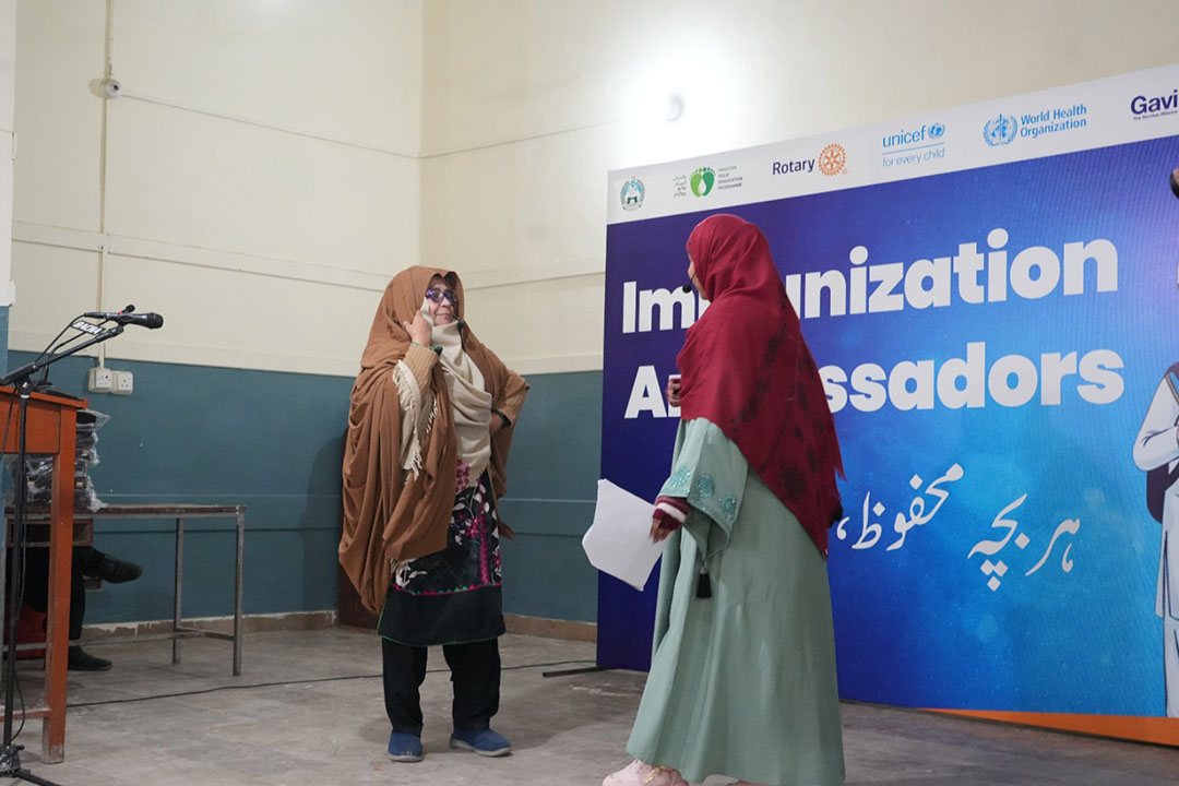 A vaccinator convincing an elderly women whose family has misconceptions about the importance of vaccines to protect their children against preventable diseases. Credit: Emergency Operation Centre