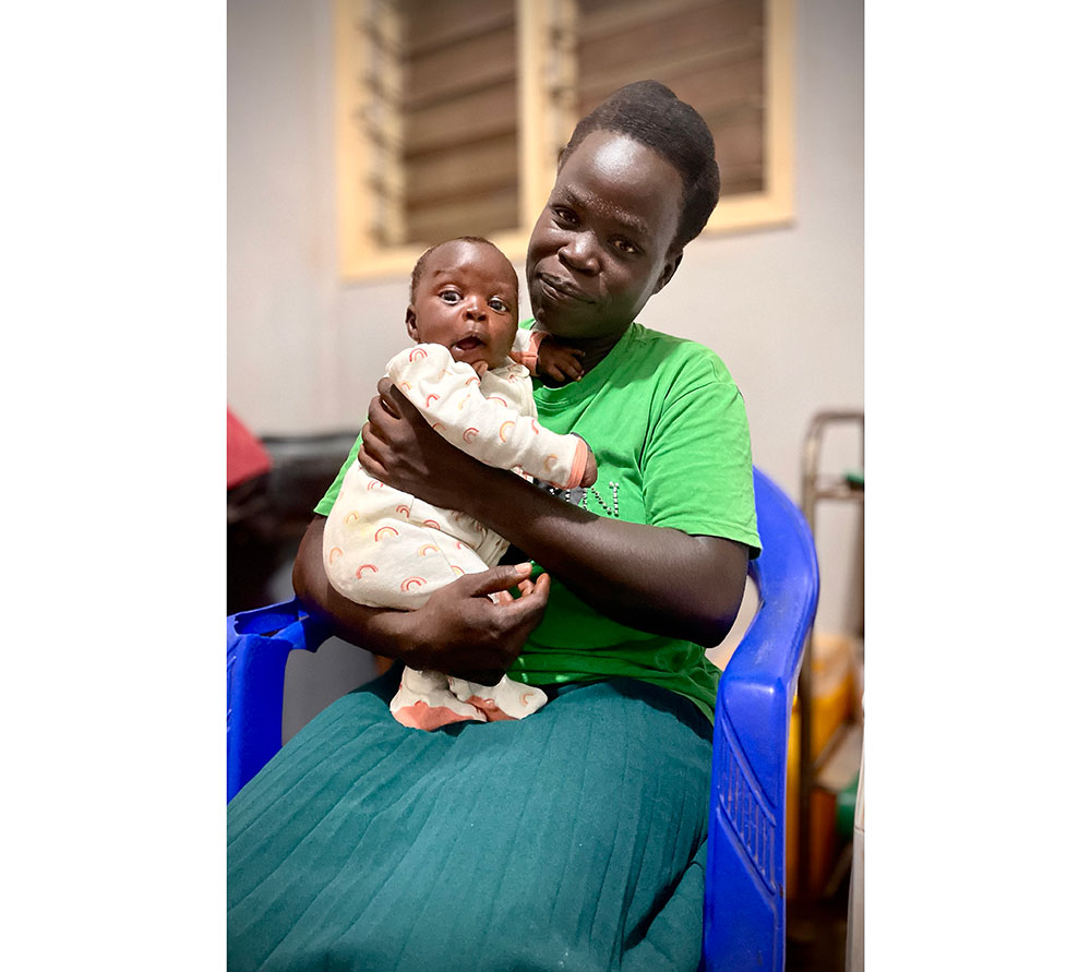 Sarah Among was glad that she had taken her baby to receive the malaria vaccine. Credit: John Agaba