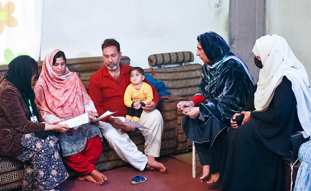 The REEDS Community Engagement Specialists listened to Siraj’s family in their house. © REEDS, Pakistan