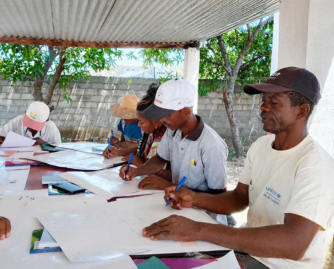 The project team mapping areas where zero-dose and under-immunised children have been identified in the Sambava. © Jhpiego region, Madagascar