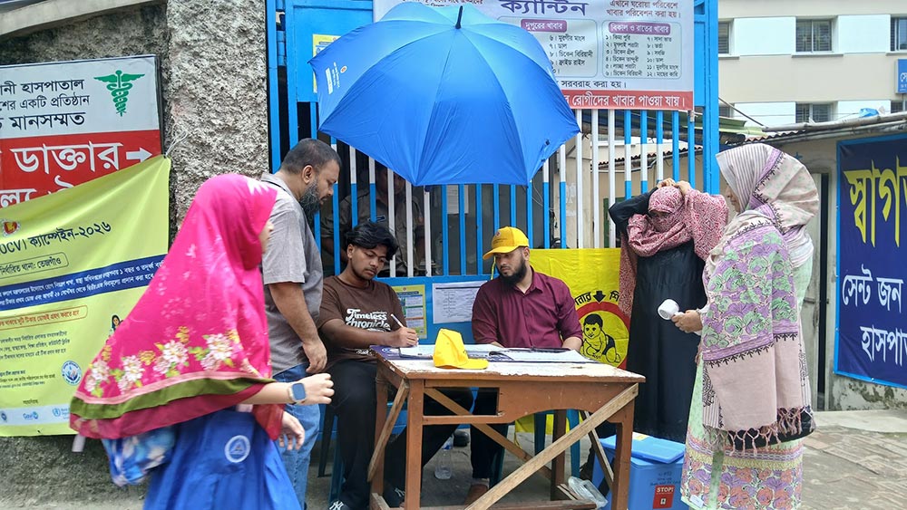 Volunteers register vaccine-seekers at on the spot at St. John Vianney Hospital in Tejgaon, Dhaka. Credit: Mohammad Al Amin