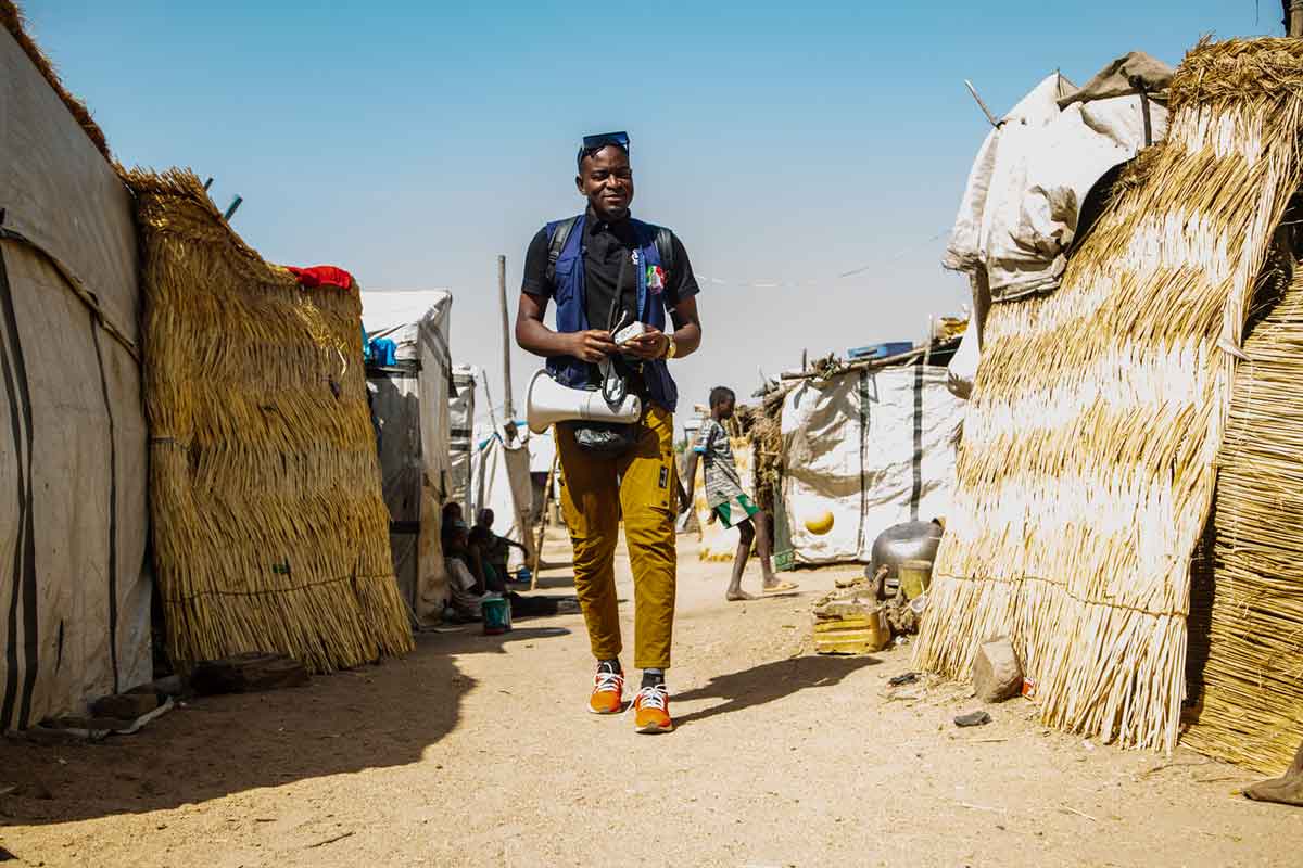 Dr. Mabout exiting the Domayo Displacement Camp in Maroua after a sensitisation outreach. Credit: Akem Nkwain.