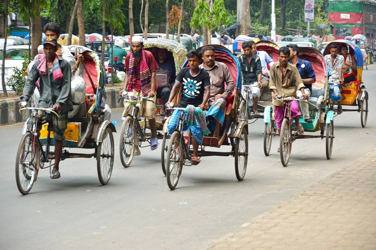 “Ten minutes of running rickshaw means twenty minutes of rest. I get exhausted quickly,” said Tayeb Ali, a rickshaw puller. Image by Biswarup Ganguly via Wikimedia Commons (CC BY 3.0).