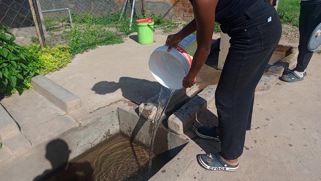 Due to water shortages, many residents in Zimbabwe now rely on community water sources for their daily needs. Credit Derick Matsengarwodzi